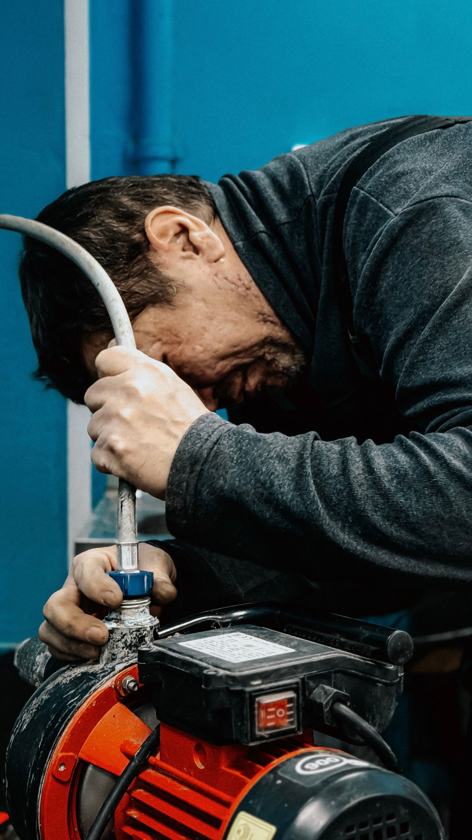 Technician servicing a water pump motor